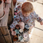 Photo de bavoirs manches fleurs mushie 2 par Les Biscottes